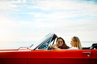 Buy stock photo Friends, woman and driving car for road trip, adventure and freedom or luxury on holiday or vacation. Excited people and young driver with license, convertible and cool vehicle for journey and travel