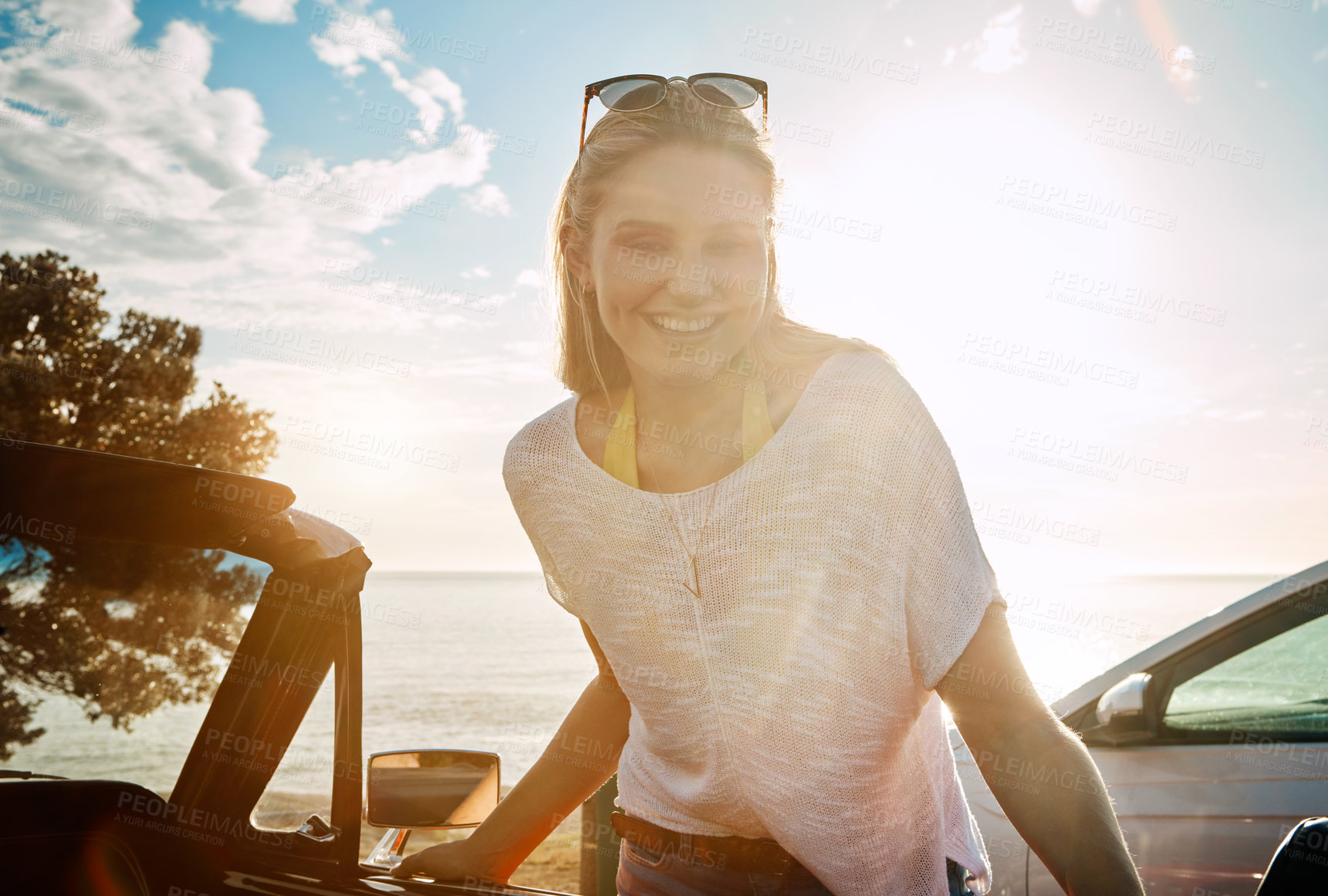 Buy stock photo Sunset, road trip and woman by beach with travel for summer vacation, journey or holiday. Happy, nature and female person with car for self discovery adventure at weekend destination in California