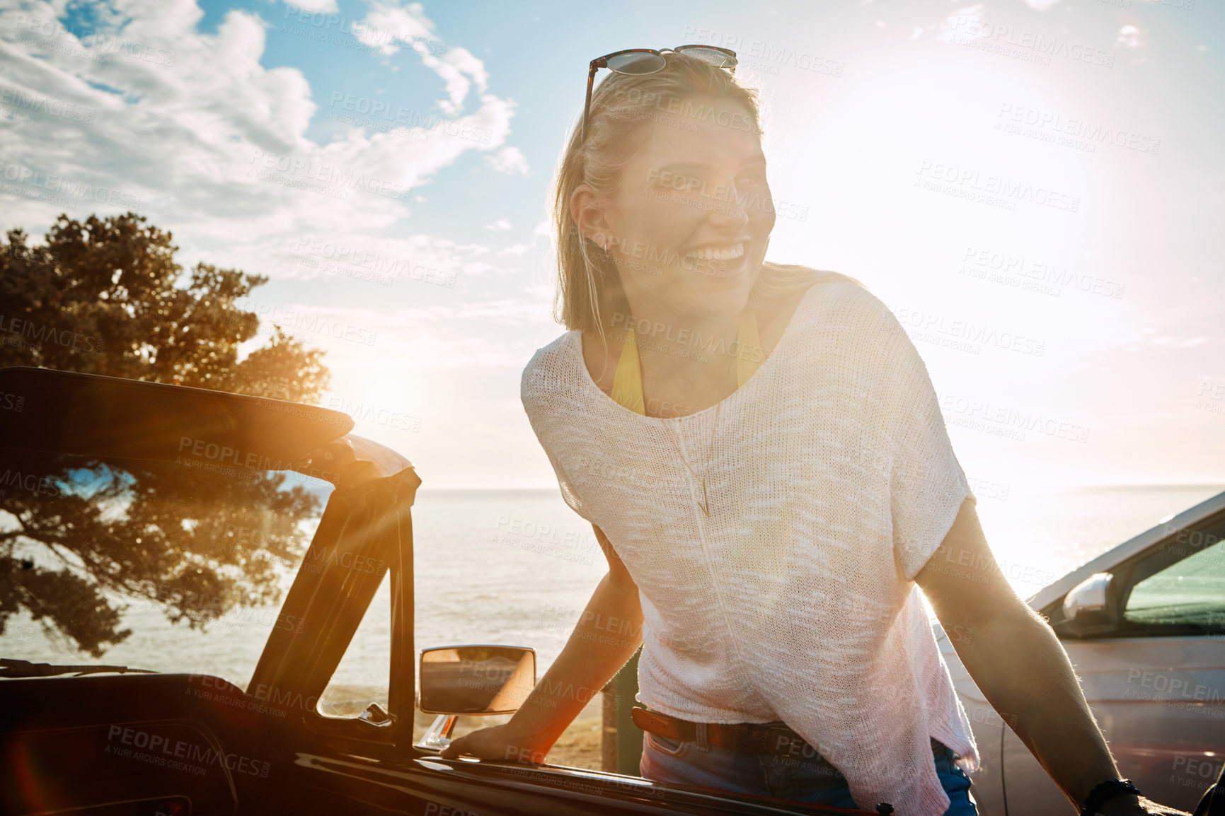Buy stock photo Sunset, road trip and woman with adventure by beach for summer vacation, journey or holiday. Happy, nature and female person with car for self discovery travel at weekend destination in California