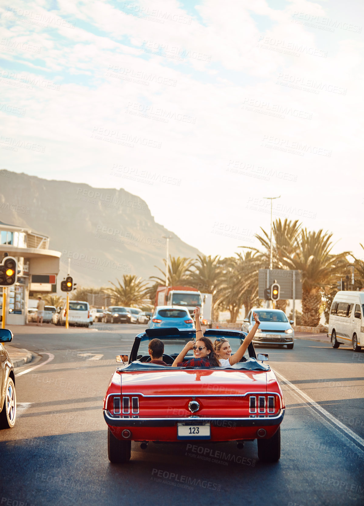 Buy stock photo City, freedom and friends in car for road trip on vacation or holiday in town for journey. Adventure, travel and group of people in convertible for drive to destination on weekend in California.