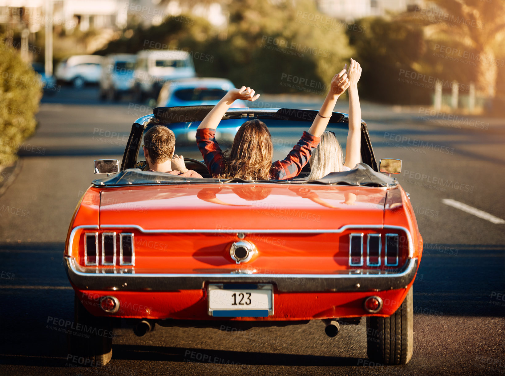 Buy stock photo Nature, freedom and people in car for road trip by sunset for countryside vacation or holiday. Adventure, travel and friends in convertible for driving to destination on weekend trip in Ireland.