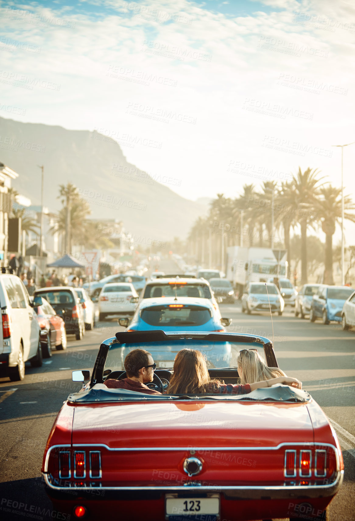 Buy stock photo Friends, people and driving convertible for city adventure, travel and freedom or luxury and style in Florida USA. Back of group and driver in cool car on road for summer journey, holiday or vacation