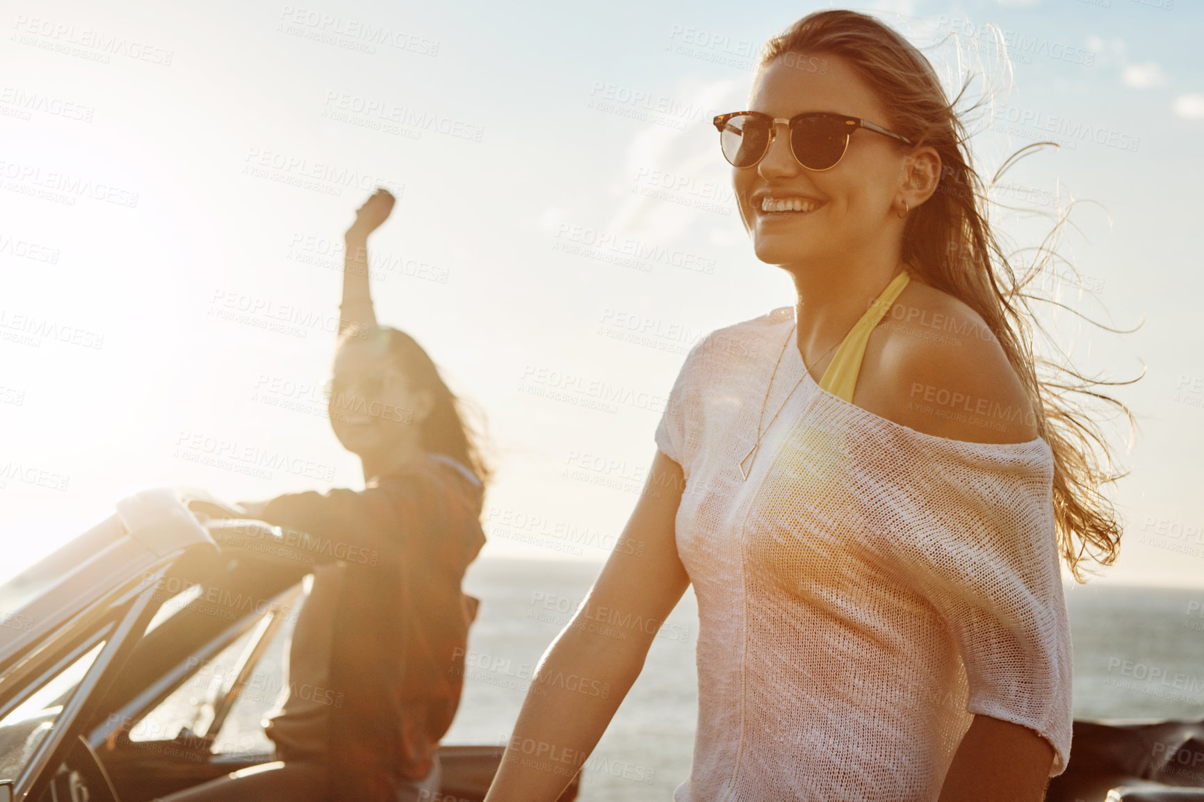 Buy stock photo Happy, portrait and woman with travel by ocean for outdoor adventure, vacation or break in convertible. Smile, summer and friends with drive on road trip for holiday, sunset and freedom in Croatia