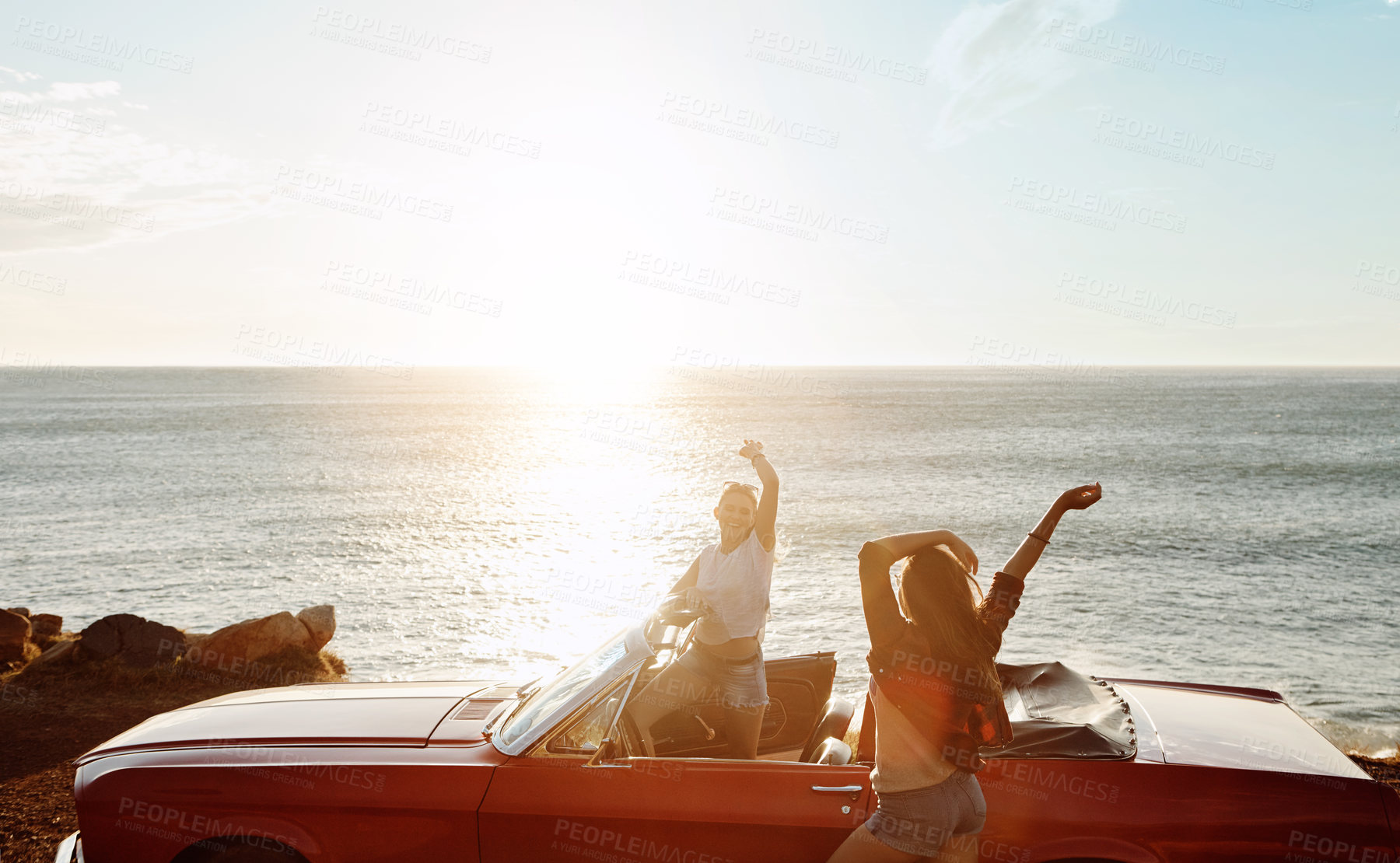 Buy stock photo Travel, freedom and women with car by ocean for outdoor sunset adventure, vacation and break. Happy, drive and friends with convertible on road trip for tourism, holiday and sightseeing in Croatia