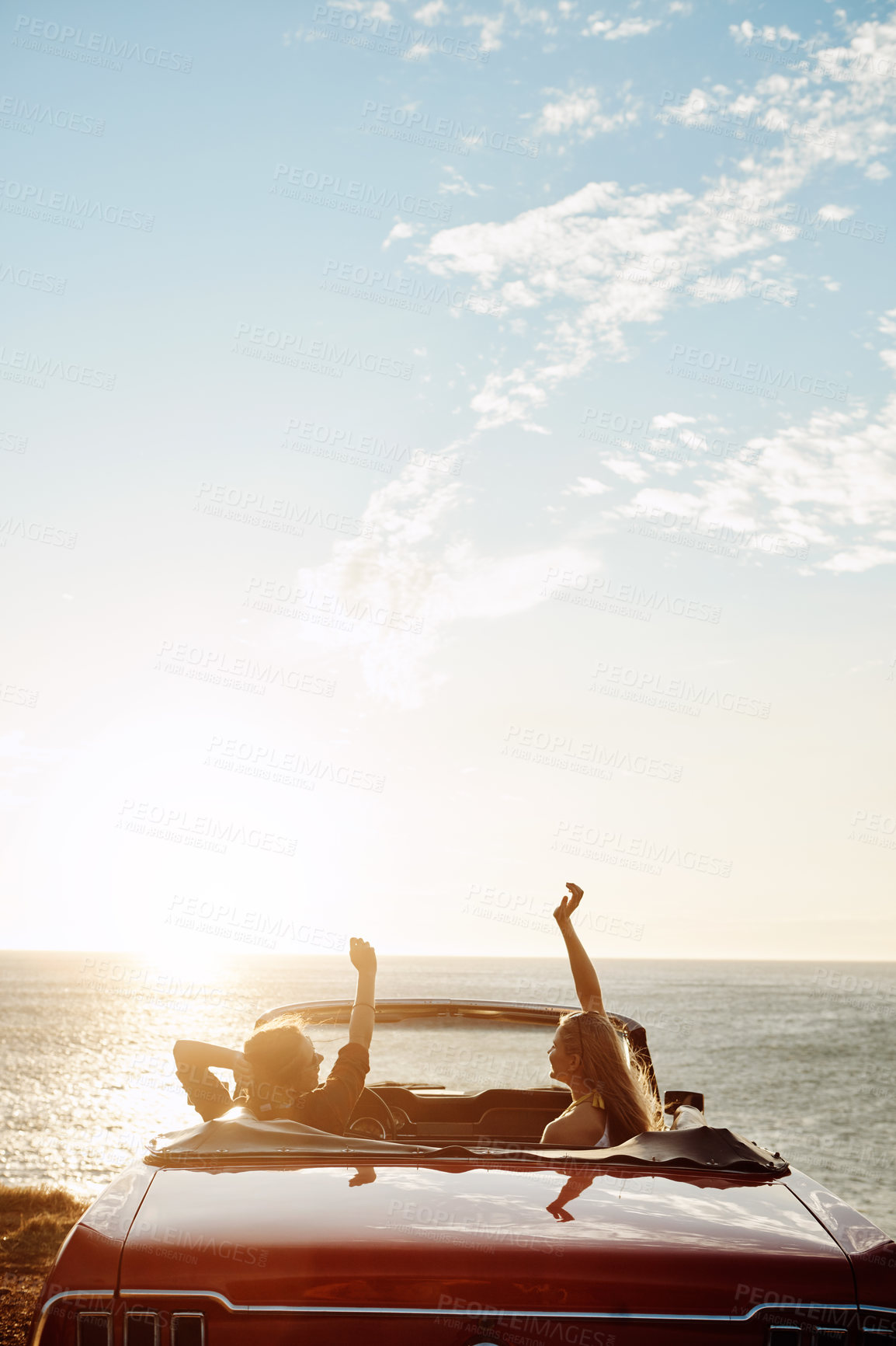 Buy stock photo Friends, woman and sunset in car at ocean with freedom, scenery and travel adventure with mockup space. Road trip, people and convertible vehicle on coast at beach for sightseeing and sunrise view