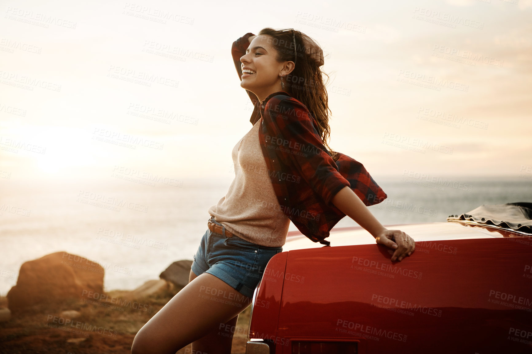 Buy stock photo Road trip, smile and sunset with woman outdoor at coast for holiday, travel or vacation in summer. Sunshine, ocean and thinking with happy person on beach for adventure, break or transportation