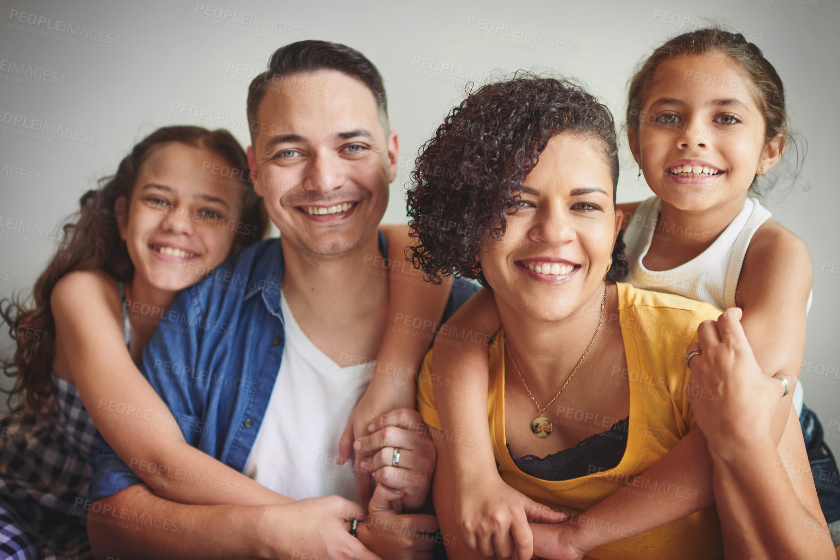 Buy stock photo Portrait of a happy young family spending quality time together