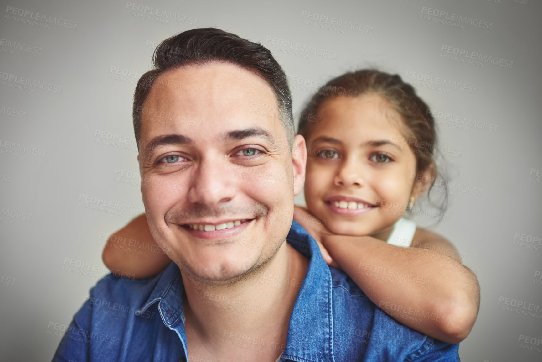 Buy stock photo Portrait, father and daughter hug with love for affection, security and bonding together of relationship. Smile, girl and man for embracing of care, comfort and family connection on studio background