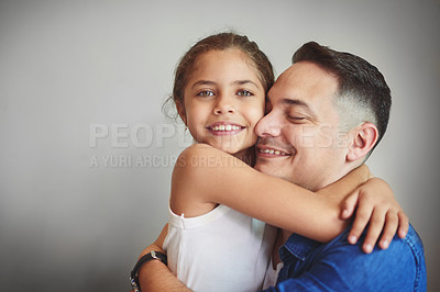 Buy stock photo Smile, father and daughter hug with love for affection, security and bonding together of relationship. Happy, girl and man with embracing for care, comfort and family connection on studio background