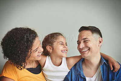 Buy stock photo Shot of a happy young family spending quality time together
