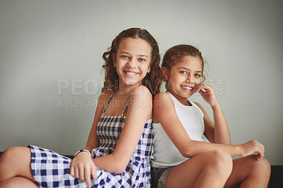 Buy stock photo Shot of two young girls spending time together at home