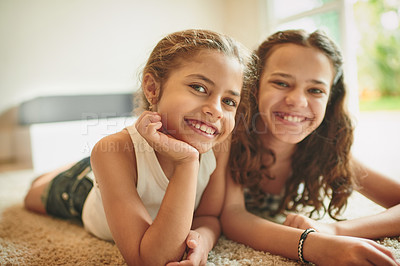 Buy stock photo Shot of two young girls spending time together at home