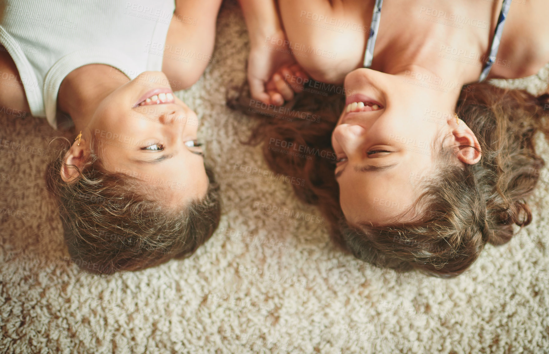 Buy stock photo Sister, girl children and happy on floor with bonding, playing together and support in relationship. Top view, people and siblings on carpet for relax, enjoying weekend and laughing for joke in home