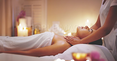 Buy stock photo Shot of a beautiful young woman enjoying a shoulder massage at a beauty spa