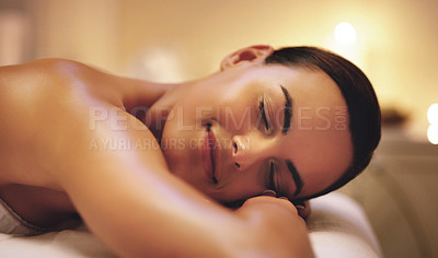 Buy stock photo Shot of a beautiful young woman relaxing during a spa treatment