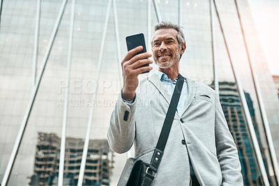 Buy stock photo Corporate, man and scroll with phone in city of morning commute, communication and transport service. Low angle, mature lawyer and mobile app with taxi request, meeting schedule and travel location