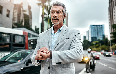 Buy stock photo Mature, businessman and checking time in city for planning as real estate agent for morning commute. Male person, outdoor and running late with thinking, travel or career in property investment in UK