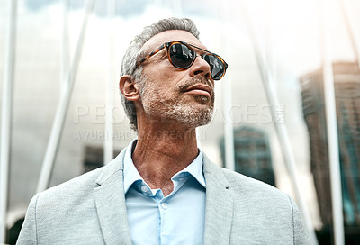 Buy stock photo Shot of a mature businessman out in the city