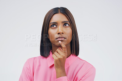 Buy stock photo Thinking, confused and woman in studio with decision on mockup, space and grey background. Choice, contemplation and Indian female person with doubt, emoji and confusion, pensive and puzzled thoughts