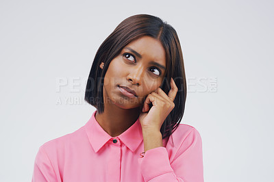 Buy stock photo Confused, thinking and woman in studio with decision on mockup, space and white background. Choice, contemplation and indian female person with doubt, emoji and problem solving of ideas for questions
