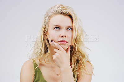 Buy stock photo Young woman, thinking and decision in studio with ideas, memory and focus by gray background. Girl, model and think with concentration, remember and confused for choice, planning or question on mind