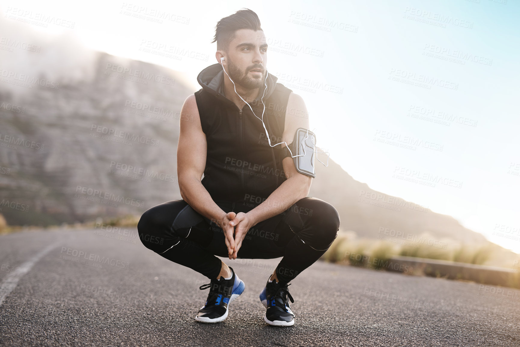 Buy stock photo Man, tired and sport in road for outdoor workout, exercise and wellness as fitness routine. Male person, athlete and earphones with fatigue, health or cardio in rest or break for training or recovery