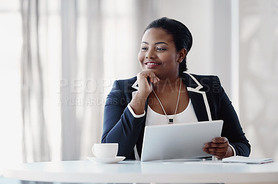 Buy stock photo Cropped shot of an attractive young businesswoman looking thoughtful while working on her tablet in the office