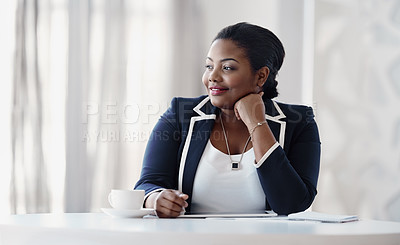 Buy stock photo Cropped shot of an attractive young businesswoman looking thoughtful while sitting behind her desk in the office