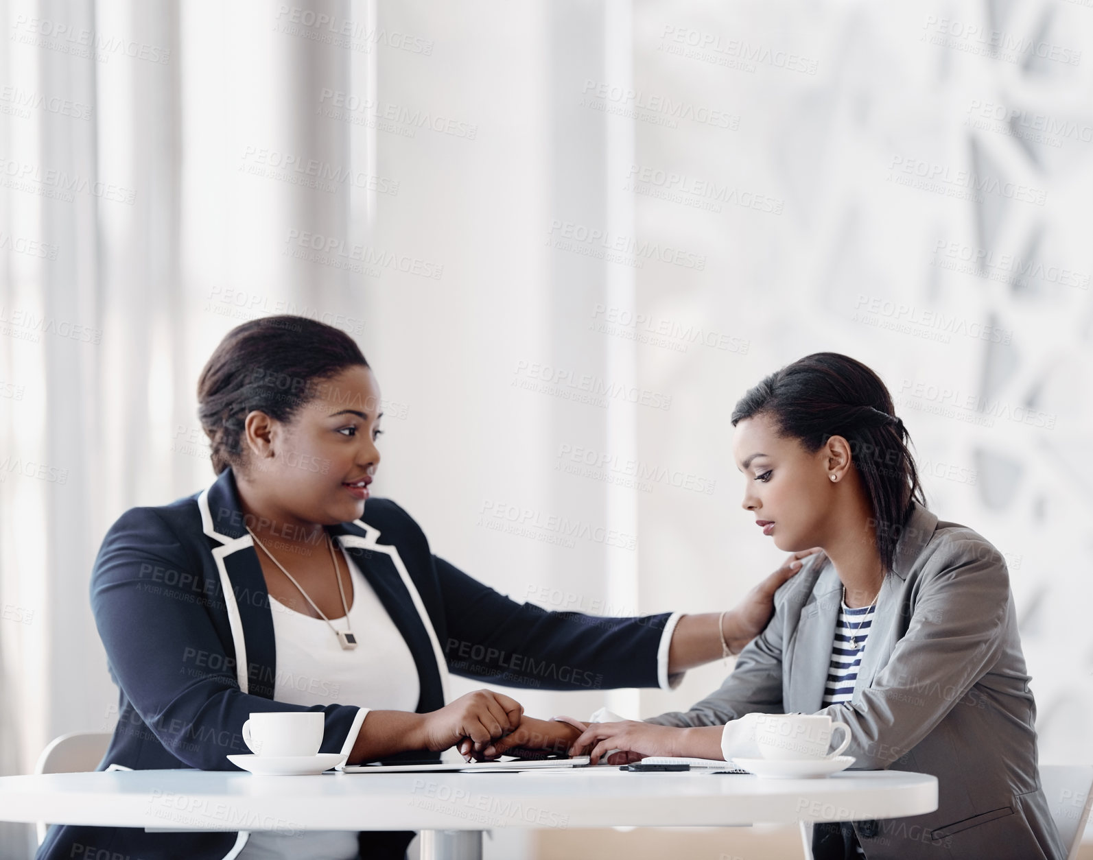 Buy stock photo Care, women and support in office with empathy, listen or solidarity with holding hands. Female people, comfort and compassion for grief counselling, conversation and mental health at work or company