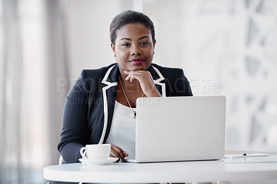 Buy stock photo Cropped portrait of an attractive young woman looking thoughtful while working on her laptop in the office