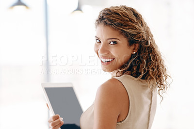 Buy stock photo Cropped portrait of an attractive young businesswoman using her laptop while standing in the office