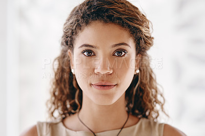 Buy stock photo Cropped portrait of an attractive young businesswoman standing in her office