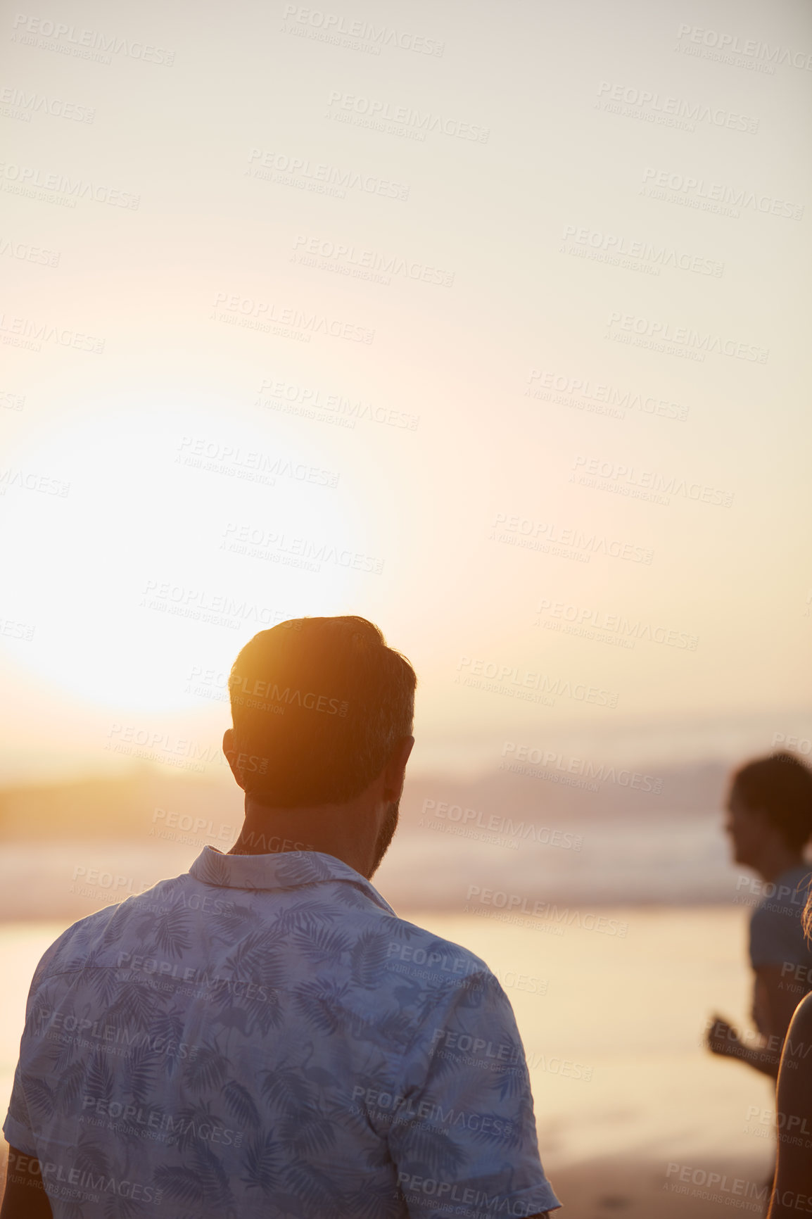 Buy stock photo Rearview shot of a mature couple spending quality time on the beach