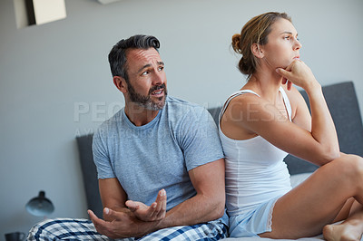 Buy stock photo Woman, couple and conflict on bed with argument for disagreement, fight and cheating affair. Stress, people or ignore for toxic relationship, marriage fail and breakup with dispute in bedroom of home