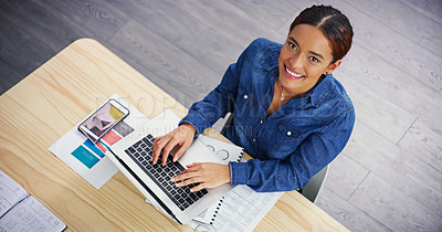 Buy stock photo Portrait of an attractive young businesswoman using a laptop at her office desk at work