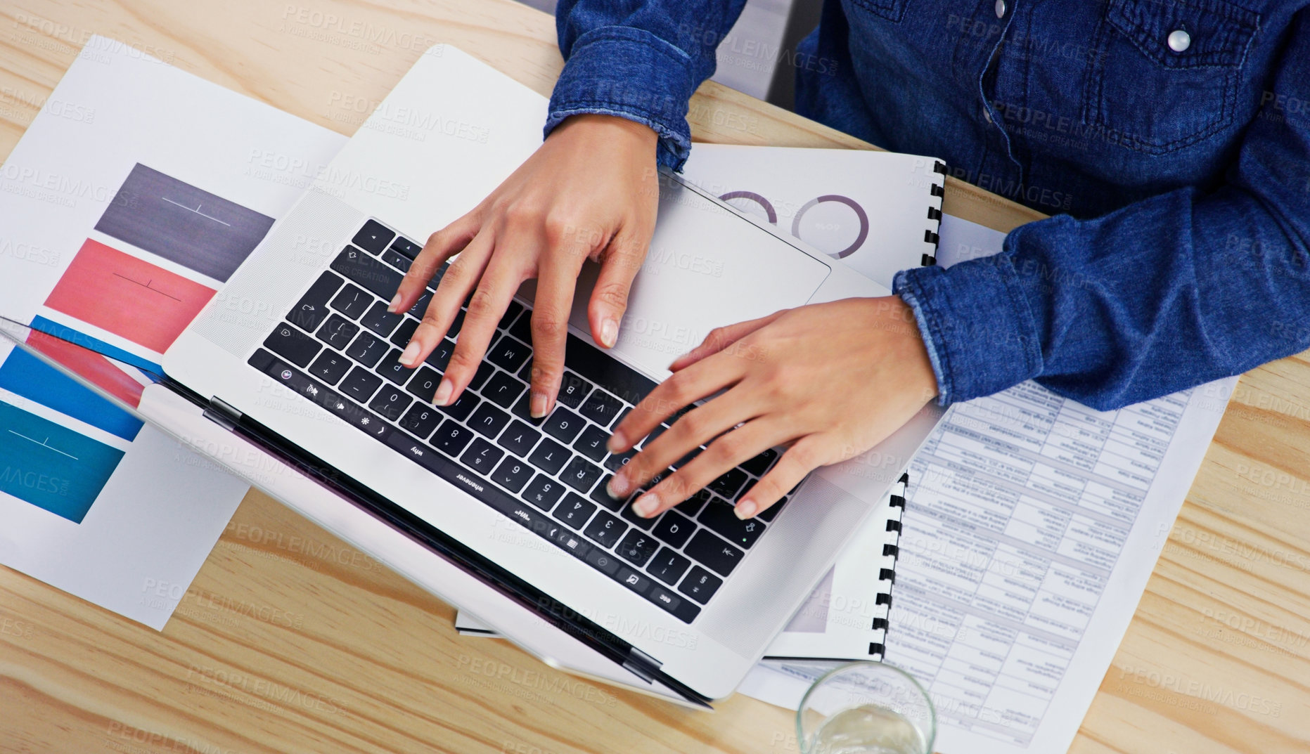 Buy stock photo Hands, laptop and finance from above with a business woman typing on a keyboard in her accounting office. Computer, documents and financial budget with an employee planning an investment strategy