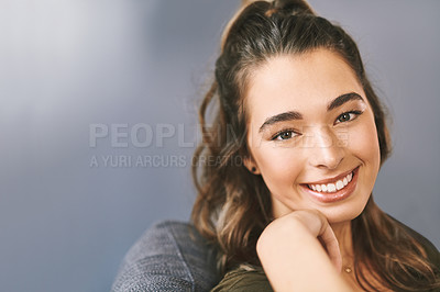 Buy stock photo Portrait of a beautiful young woman relaxing on her sofa at home