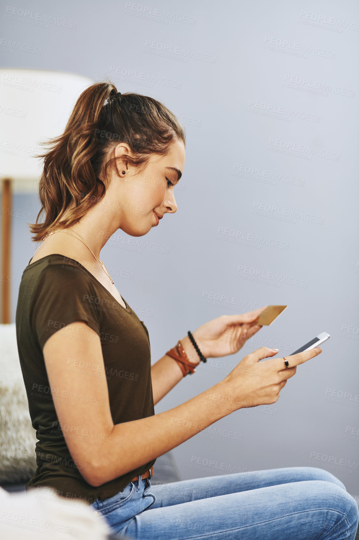 Buy stock photo Payment, mobile and woman with credit card on sofa for online shopping, e commerce or transaction in living room. Relax, app and young girl for purchase, subscription or internet banking in home