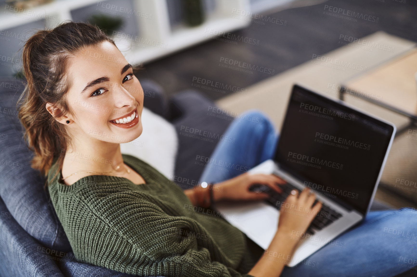 Buy stock photo Girl, laptop and happy in portrait on sofa in home with elearning, studying and education in morning. Woman, person and student on couch with computer, video and excited for online course in Portugal