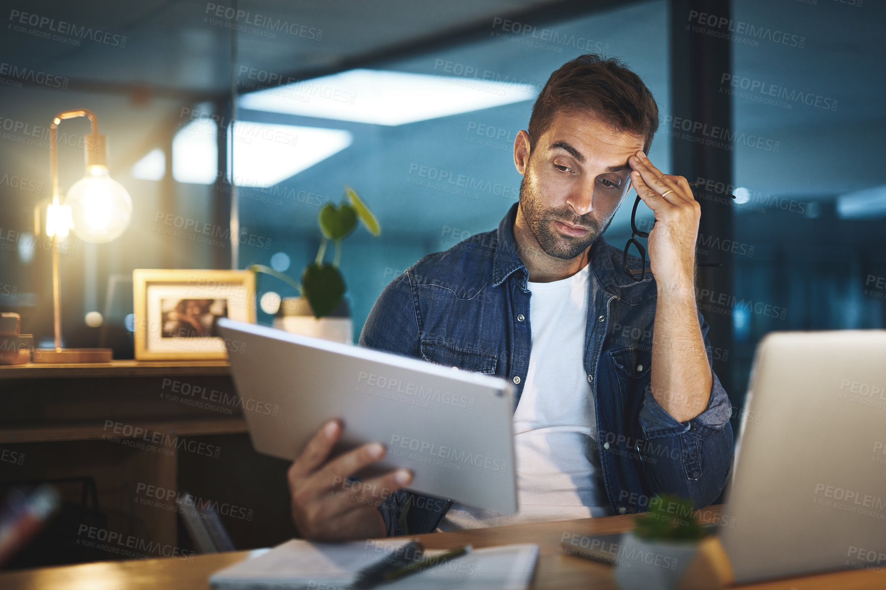 Buy stock photo Businessman, headache and stress of reading on laptop with stock market crash, burnout or overworked. Employee, trader or migraine at desk in office for investment mistake or economy crisis at night