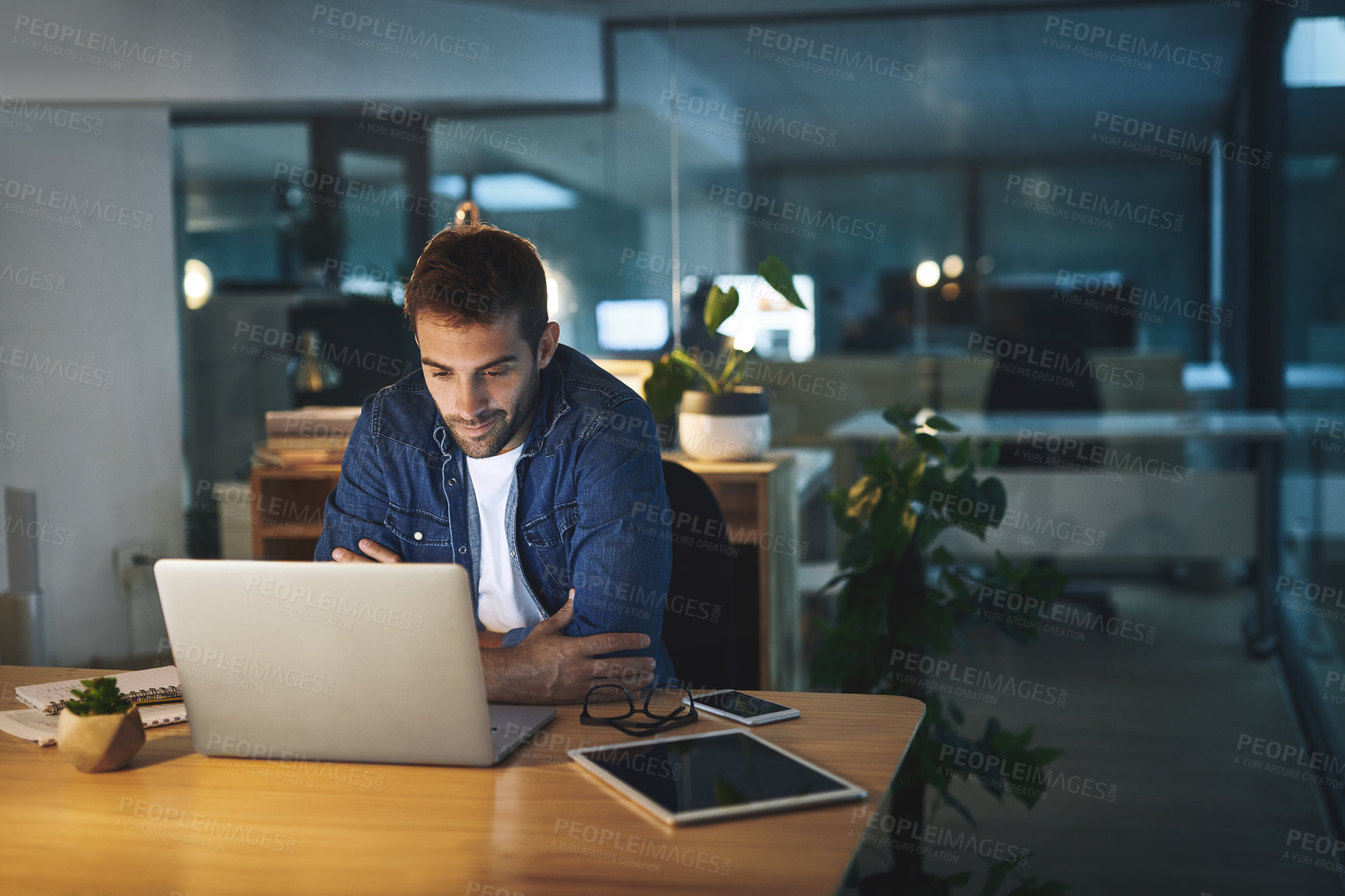 Buy stock photo Night, thinking and man at desk with laptop, business planning or checking email at digital agency. Late, dark and consultant reading web report with computer, ideas and online research in office