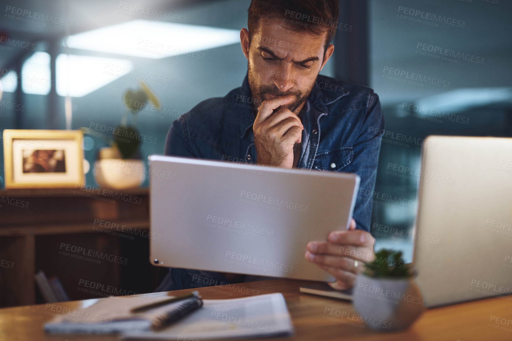 Buy stock photo Thinking, office and businessman on tablet in dark for research, online website and internet. Professional, night and person on digital tech working late for planning, solution and problem solving