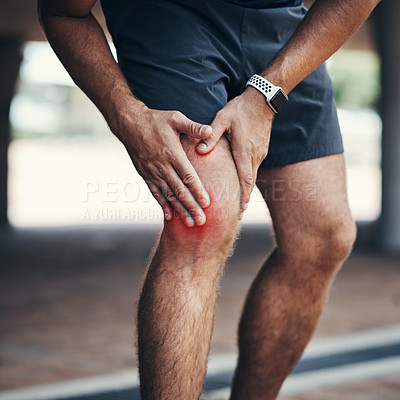 Buy stock photo Closeup shot of an unrecognizable man holding his knee in pain while exercising outdoors