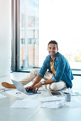 Buy stock photo Man, portrait and typing on laptop on floor in office for research, information and brainstorming of financial growth. Male person, digital and paperwork with chart, data analysis and startup budget