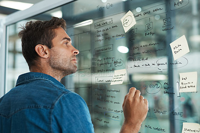 Buy stock photo Creative, man and writing on glass for planning, customer expansion strategy and consumer insight for growth. Employee, market researcher and brainstorming on board in office for calendar schedule.