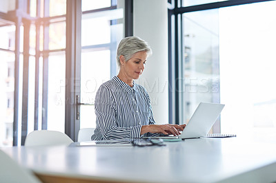 Buy stock photo Woman, research and table with laptop in office for investment, report and reading finance news. Mature financial advisor, notes and typing with tech for foreign exchange, trading or update to client