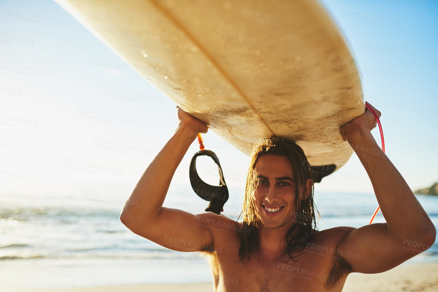 Buy stock photo Beach, man and happy with surfboard on head for surfing as hobby or sports in Australia. Male person, ocean and recreation for fitness, exercise and training for tournament, competition and games