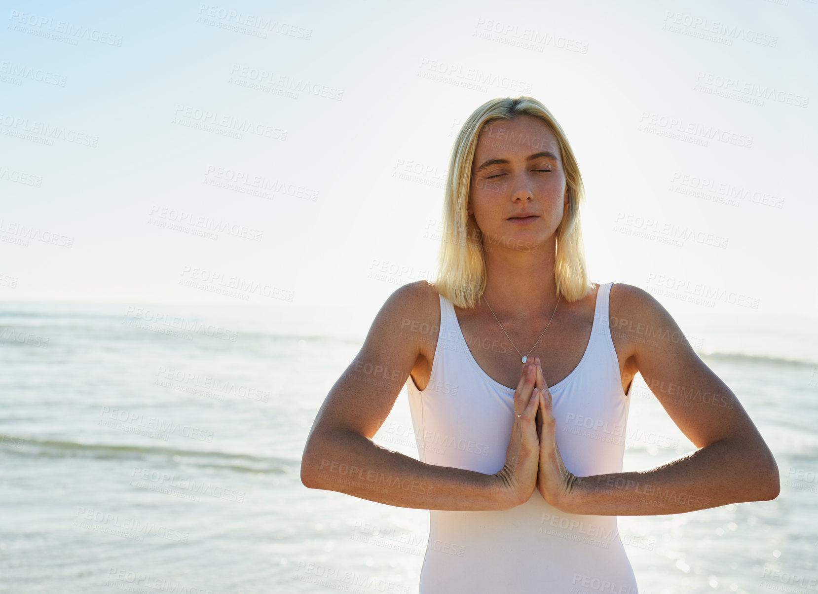 Buy stock photo Beach, prayer hands and woman with meditation by waves for holistic healing, mindfulness and awareness. Zen, person and peace with eyes closed by ocean for chakra balance, exercise and mental health