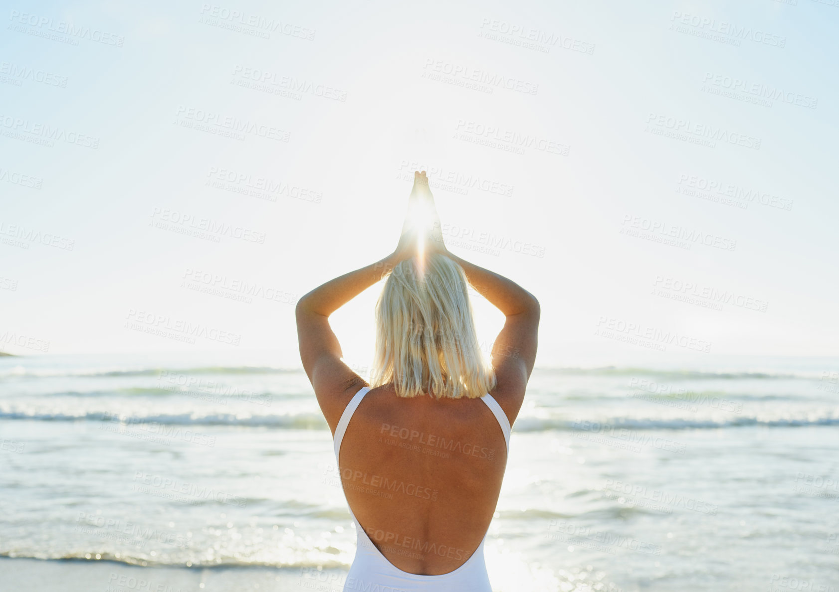 Buy stock photo Beach, prayer hands and back of woman with meditation for chakra balance, mindfulness and awareness. Zen, person and calm with peace by ocean waves for holistic healing, exercise and mental health