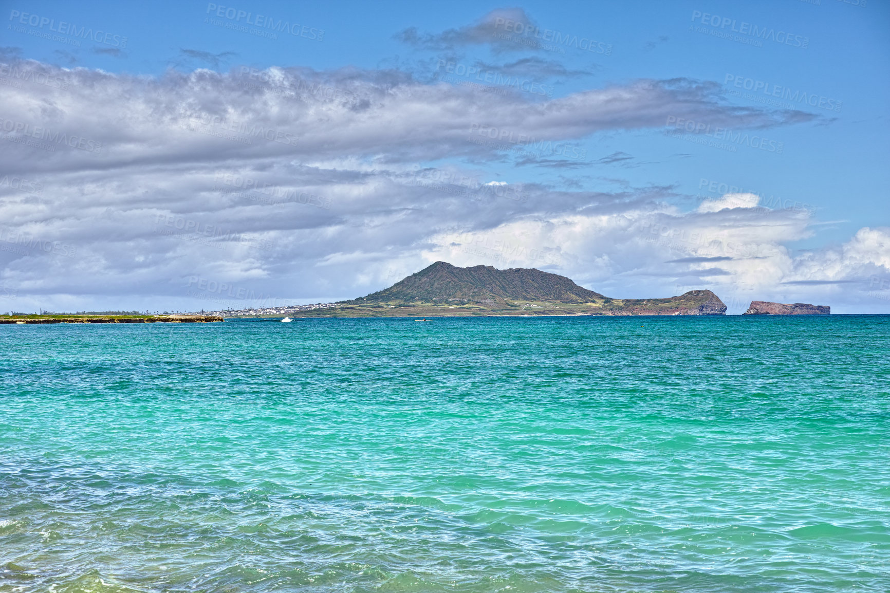 Buy stock photo Island, nature and ocean with water outdoor for tropical holiday, sea ripple and travel destination. Beach, blue sky and clouds with mountain view, summer paradise and vacation getaway of landscape